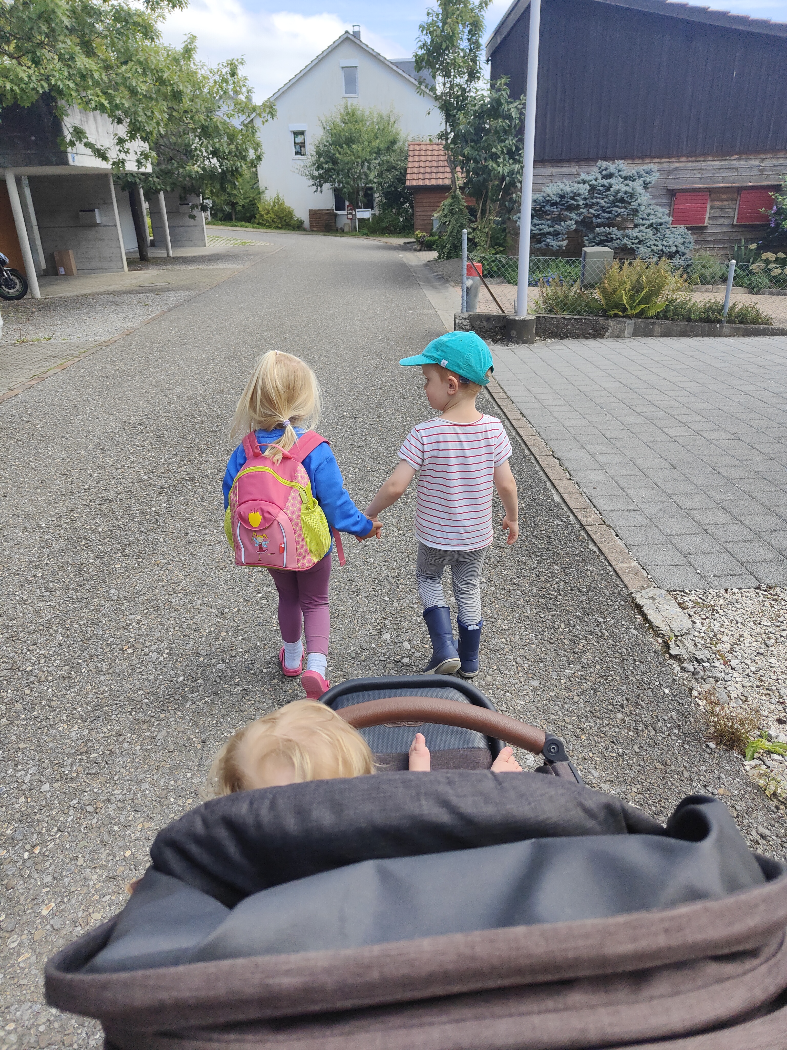 Two children enjoying the outdoors at golden hour
